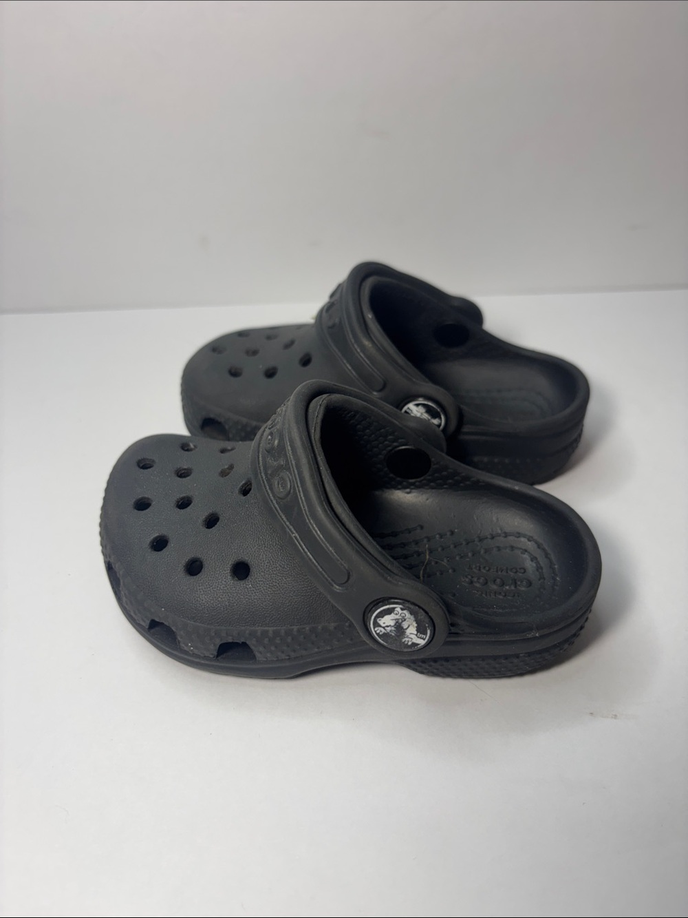 CROCS Kids Black Clogs with Orange Accent Charm